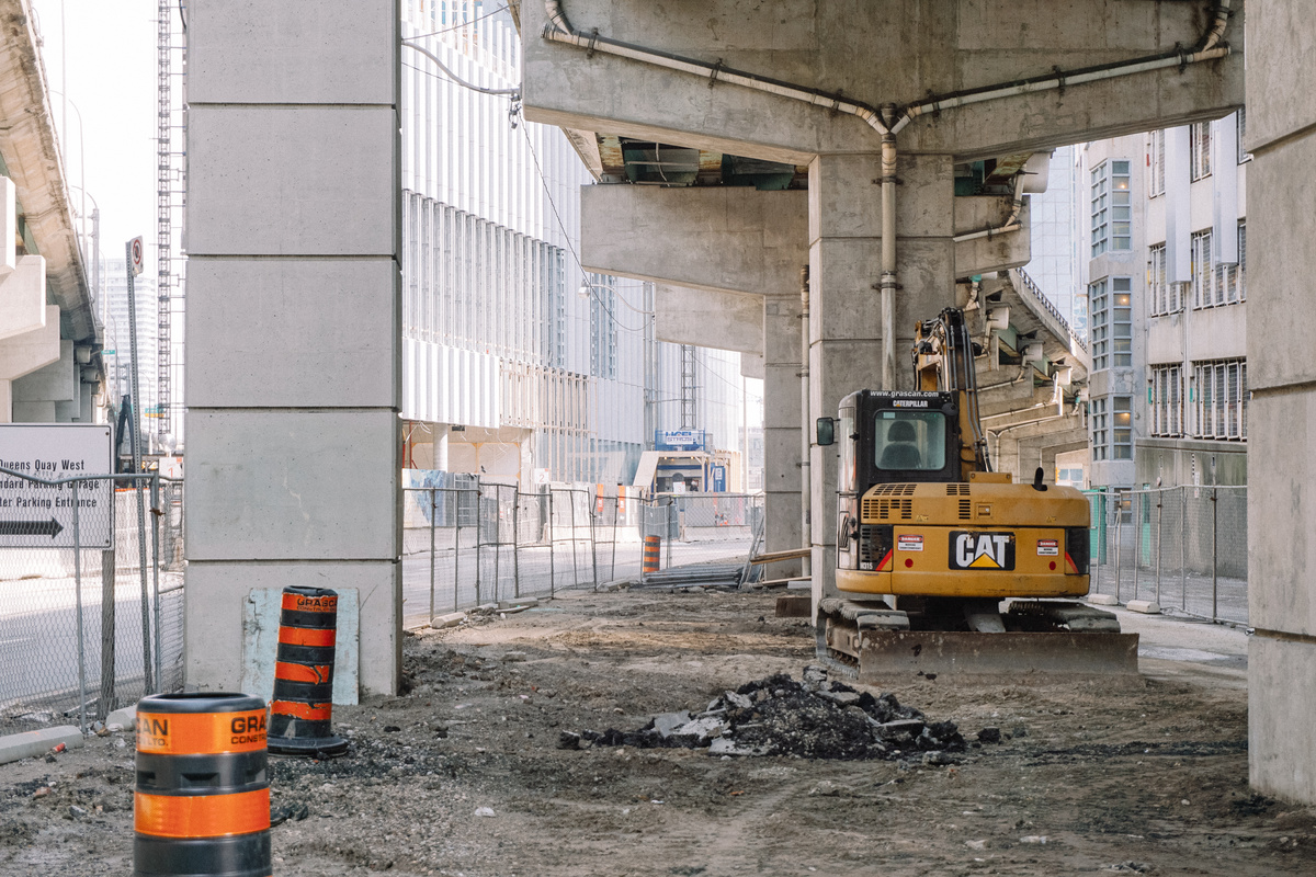 Under bridge site with heavy machine